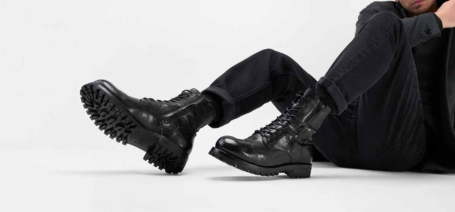 CAMDEN tar-black double-zip military boots.